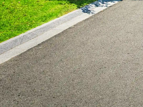 Clean driveway with green grass edging at a residential property in High Point, NC